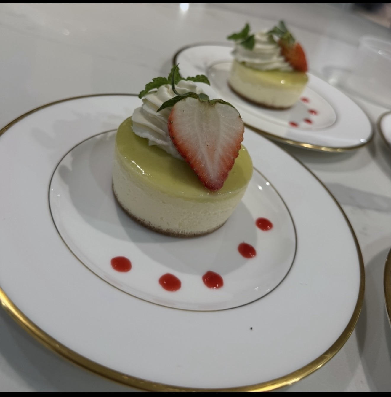 Key lime cheesecake with strawberry and mint
