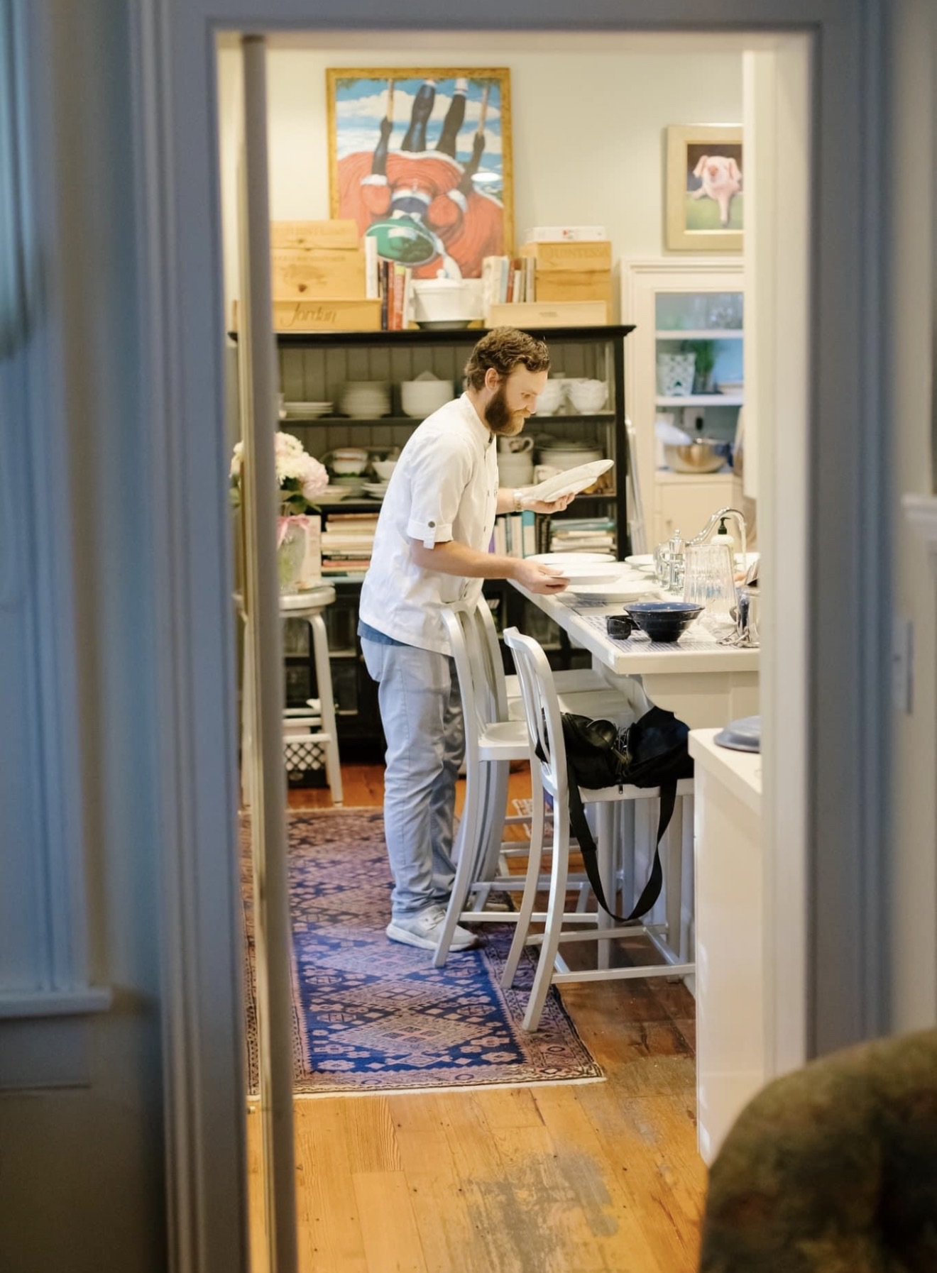 Chef Kurt Hall preparing plates in the kitchen